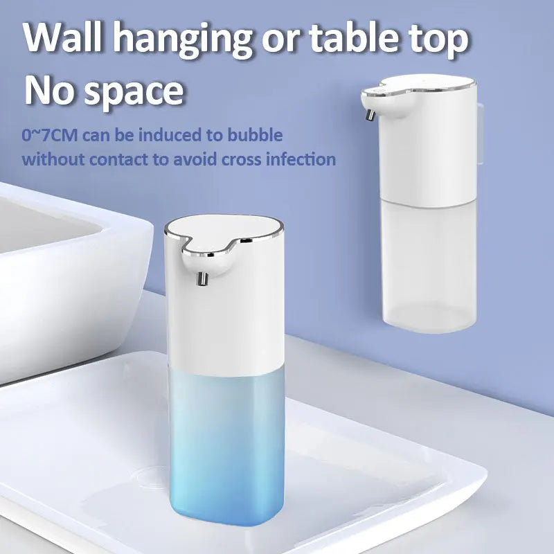 Automatic foam soap dispenser suitable for wall-mounted or tabletop use, minimalist white design with transparent blue reservoir, touchless operation, ThuisGemak.