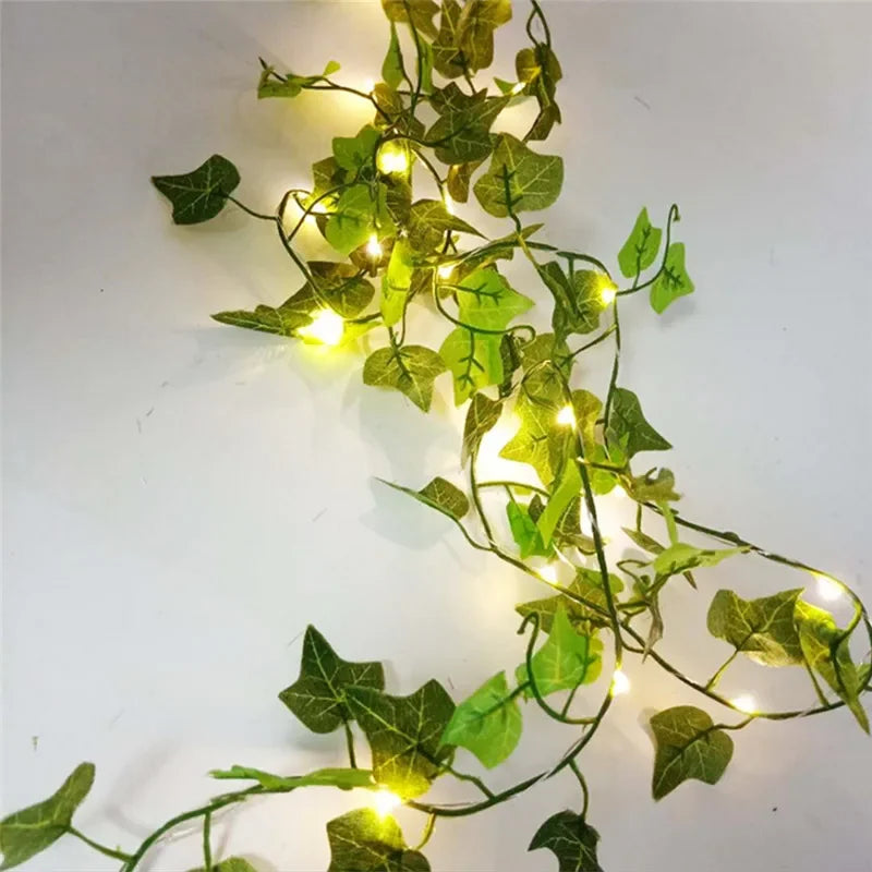 Elegant ivy garland adorned with warm golden fairy lights, casting a gentle, ambient glow across a light surface