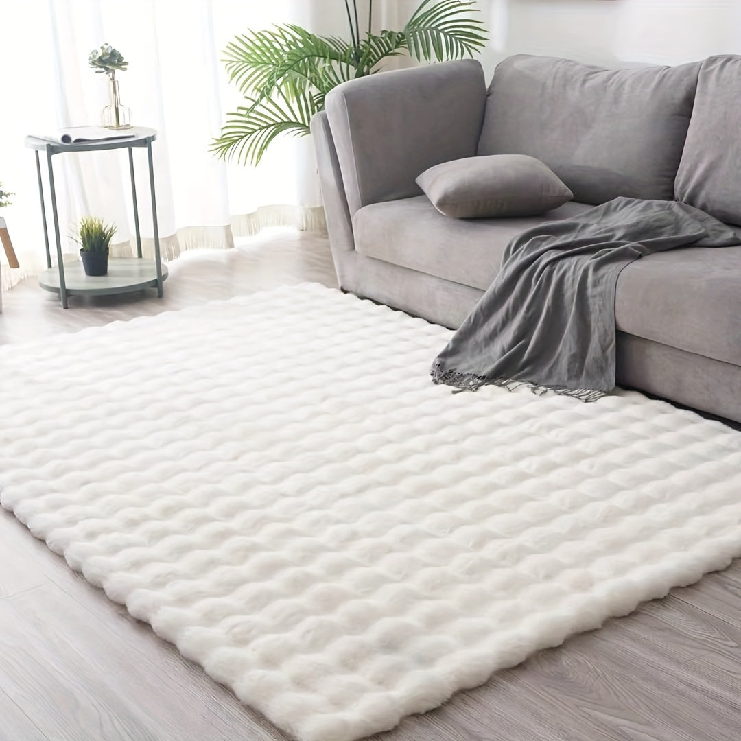 Soft white textured rug with bubble pattern in a bright modern living room featuring a grey sofa and natural light, ThuisGemak.