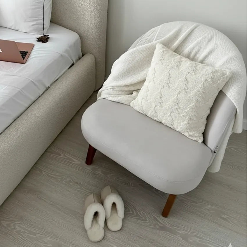 cosy christmas cushion on a poltrone